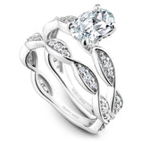 A Noam Carver white gold engagement ring with an oval centerpiece and 30 diamonds on a floral band.