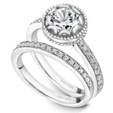 A Noam Carver white gold engagement ring with a floral setting and 18 round diamonds.