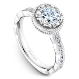 A Noam Carver white gold engagement ring with a floral setting, a detailed band and 32 round diamonds.