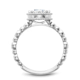 A Noam Carver white gold engagement ring with a floral setting, a detailed band and 58 round diamonds.