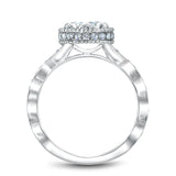 A Noam Carver white gold engagement ring with a floral setting and 52 round diamonds.