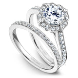 A Noam Carver white gold engagement ring with a floral halo and 36 diamonds.