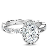 A Noam Carver white gold engagement ring with an oval centerpiece  and 36 diamonds.