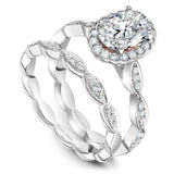 A Noam Carver white gold engagement ring with an oval centerpiece  and 36 diamonds.
