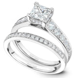 A Noam Carver white gold engagement ring with a princess cut centerpiece and 24 diamonds.