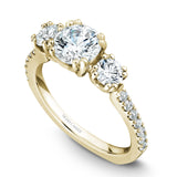 A Noam Carver yellow gold engagement ring with 16 diamonds.