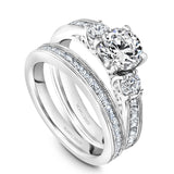 A Noam Carver white gold engagement ring with 14 diamonds.