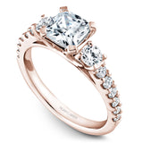 A Noam Carver rose gold engagement ring with 14 diamonds.