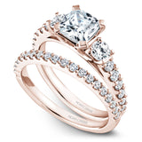 A Noam Carver rose gold engagement ring with 14 diamonds.