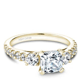 A Noam Carver yellow gold engagement ring with 14 diamonds.
