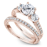 A Noam Carver rose gold engagement ring with 12 diamonds.