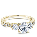A Noam Carver yellow gold engagement ring with 12 diamonds.