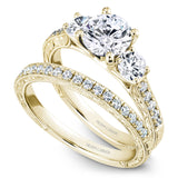 A Noam Carver yellow gold engagement ring with 12 diamonds.