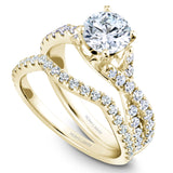 A Noam Carver yellow gold engagement ring with a twist band and 32 round diamonds.