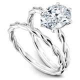 A Noam Carver white gold engagement ring with a twist band and an oval center diamond.