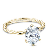 A Noam Carver yellow gold engagement ring with a twist band and an oval center diamond.