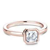 A Noam Carver rose gold engagement ring with an asscher cut solitaire diamond.