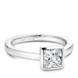 A Noam Carver white gold engagement ring with a princess cut centerpiece.