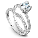 A Noam Carver engraved white gold engagement ring with 8 round diamonds.