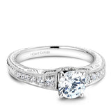 A Noam Carver engraved white gold engagement ring with 18 round diamonds on a band. 