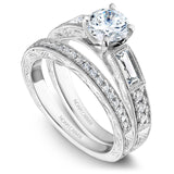 A Noam Carver engraved white gold engagement ring with 2 baguette and 8 round diamonds on a band.
