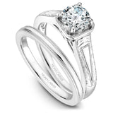 A Noam Carver engraved white gold engagement ring with a round centerpiece.