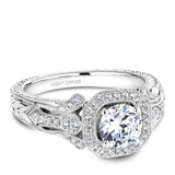 A Noam Carver engraved white gold engagement ring with a cushion halo and 44 diamonds.