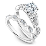 A Noam Carver engraved white gold engagement ring with a detailed band and 8 diamonds.
