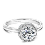A Noam Carver white gold engagement ring with 20 diamonds and milgrain detailing.
