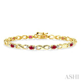 4x3 MM Oval Cut Ruby and 1/10 Ctw Single Cut Diamond Bracelet in 10K Yellow Gold