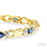 4x3 MM Oval Cut Sapphire and 1/10 Ctw Single Cut Diamond Bracelet in 14K Yellow Gold