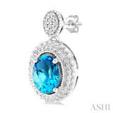 7X5 MM Oval Cut Blue Topaz and 1/20 Ctw Round Cut Diamond Semi-Precious Earrings in Sterling Silver