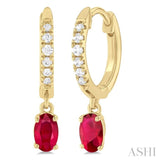 1/8 ctw Petite 5x3 MM Oval Cut Ruby and Round Cut Diamond Precious Fashion Huggies in 10K Yellow Gold