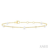 1/20 Ctw 3 MM Cultured Pearl and Round Cut Diamond Fashion Station Bracelet in 14K Yellow Gold