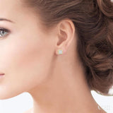 1/5 Ctw Petite Bezel Set Emerald Shape Fusion Baguette and Round Cut Diamond Fashion Stud Earrings in 10K Yellow Gold