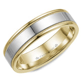 A wedding band in yellow gold with white gold center and milgrain detailing.
