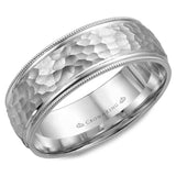 A white gold wedding band with a hammered center and milgrain detailing.