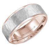A rose gold wedding band with a hammered white gold center.