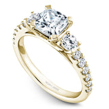 A Noam Carver yellow gold engagement ring with 14 diamonds.