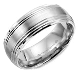 A wedding band in white gold with a brushed center and line detailing.