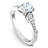 A Noam Carver white gold engagement ring with 24 round diamonds and a detailed band.