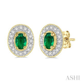 5x3MM Oval Cut Emerald and 1/4 Ctw Round Cut Diamond Earrings in 14K Yellow Gold