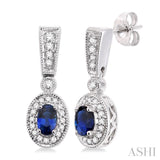 5x3MM Oval Cut Sapphire and 1/3 Ctw Round Cut Diamond Earrings in 14K White Gold