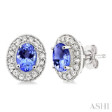 7x5mm Oval Cut Tanzanite and 3/8 Ctw Round Cut Diamond Earrings in 14K White Gold