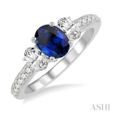 7X5mm Oval Shape Sapphire and 3/4 Ctw Round Cut Diamond Ring in 14K White Gold