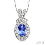 7x5mm Oval Cut Tanzanite and 5/8 Ctw Round Cut Diamond Pendant in 14K White Gold with chain